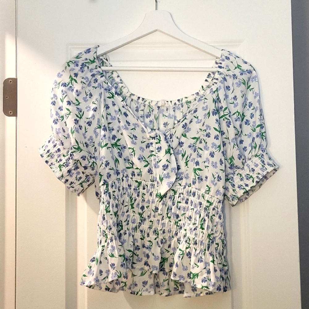 Cute white ruffle top with flowers